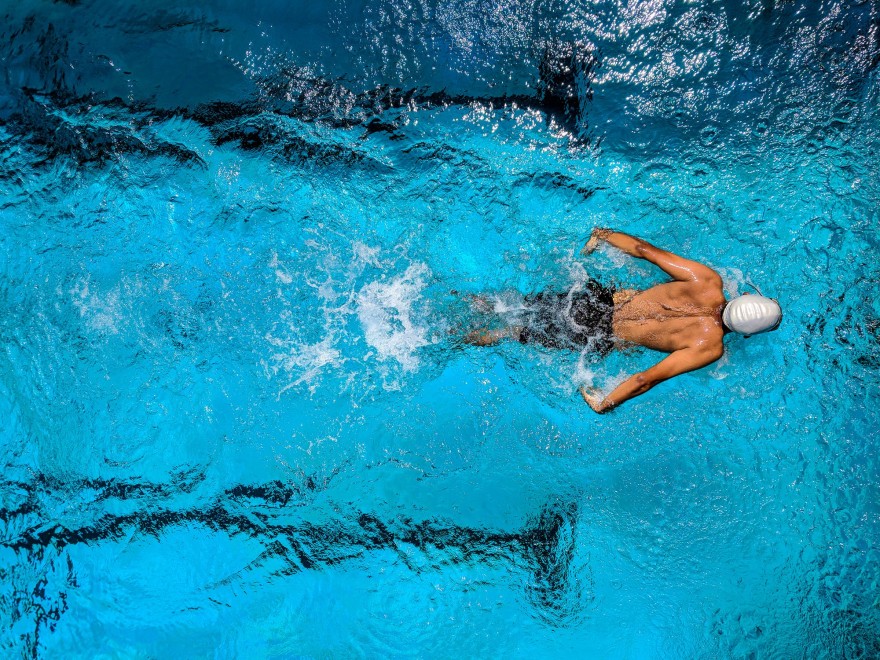 Vuojadeapmi Person Swimming on Body of Water
